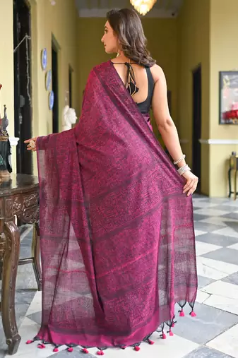 Magenta cotton linen saree with black warli art