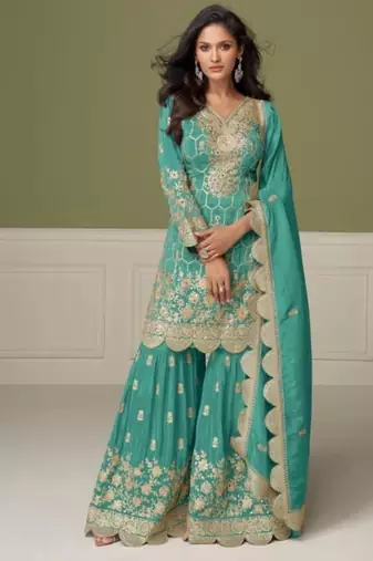 Light blue heavy shimmer silk full stitched free size upto 42 gharara suits
