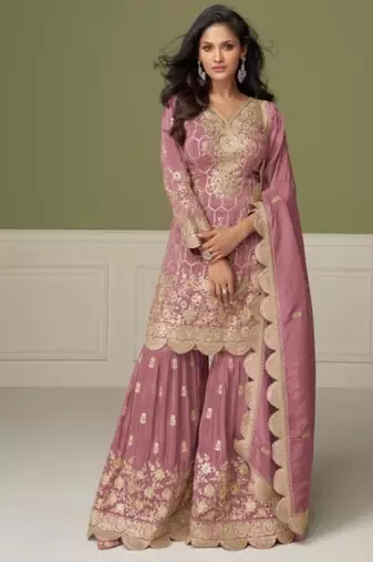 Light pink heavy shimmer silk full stitched free size upto 42 gharara suits