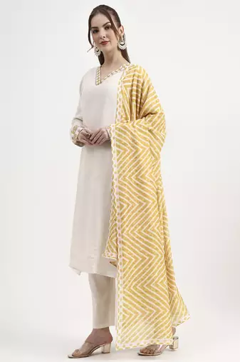 mustard yellow and off white mul chanderi silk anarkali kurta trouser dupatta set