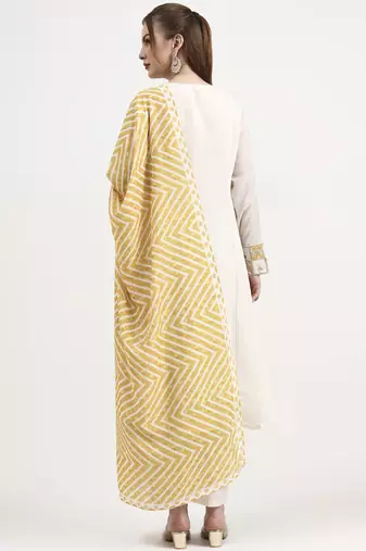 mustard yellow and off white mul chanderi silk anarkali kurta trouser dupatta set