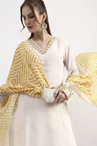 mustard yellow and off white mul chanderi silk anarkali kurta trouser dupatta set