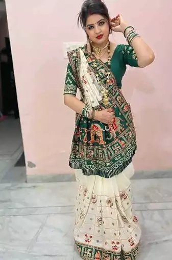 white silk saree with embroidered lace and latkan details