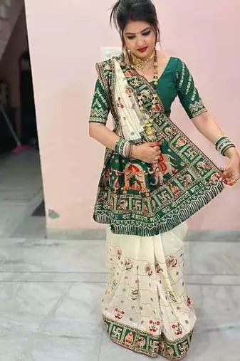 white silk saree with embroidered lace and latkan details
