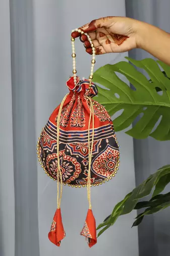 Orange pearl handle designer batwa