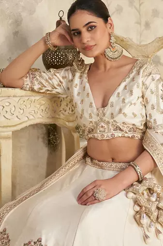 White Lehenga with Intricate Elephant Zari Work