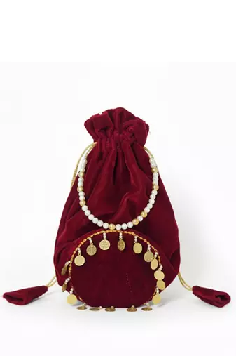 Maroon plain with sikka zumkha lace on bottom round potli