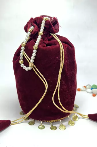 Maroon plain with sikka zumkha lace on bottom round potli