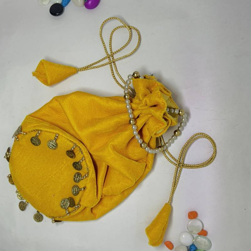 Yellow plain with sikka zumkha lace on bottom round potli