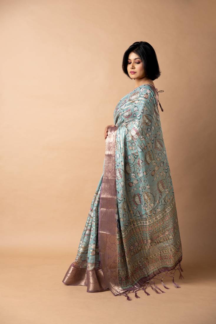 teal floral print zari woven border crepe saree with unstiched blouse piece