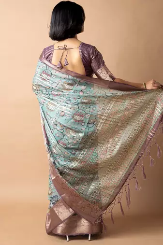 teal floral print zari woven border crepe saree with unstiched blouse piece