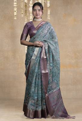 turquoise floral print zari woven border crepe saree with unstiched blouse piece 1
