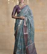 turquoise floral print zari woven border crepe saree with unstiched blouse piece