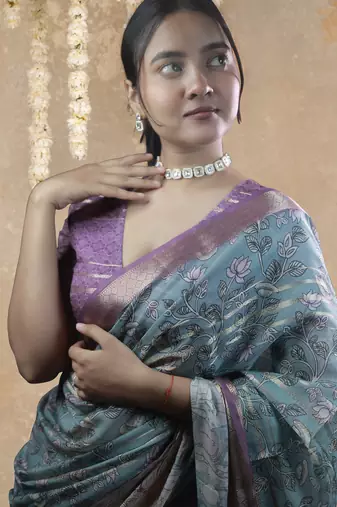 turquoise floral print zari woven border crepe saree with unstiched blouse piece