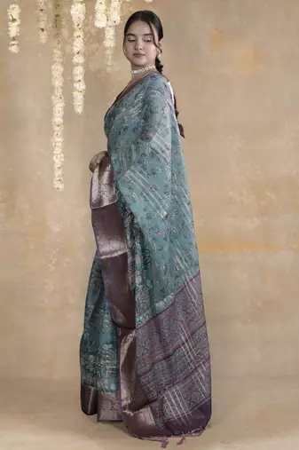 turquoise floral print zari woven border crepe saree with unstiched blouse piece