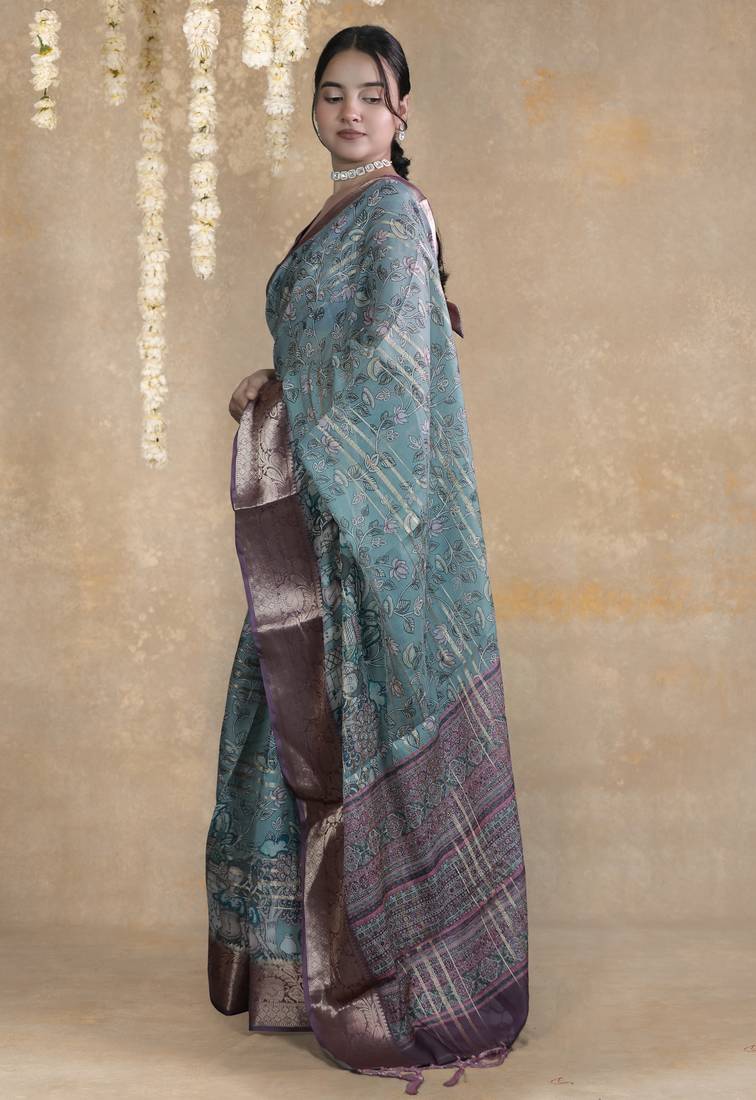 turquoise floral print zari woven border crepe saree with unstiched blouse piece