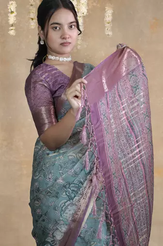 turquoise floral print zari woven border crepe saree with unstiched blouse piece