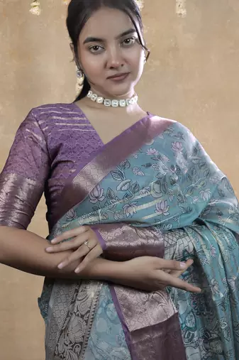 turquoise floral print zari woven border crepe saree with unstiched blouse piece