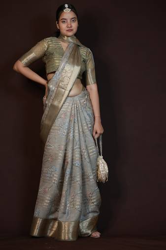 green floral print zari woven border crepe saree with unstiched blouse piece