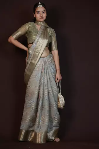 green floral print zari woven border crepe saree with unstiched blouse piece