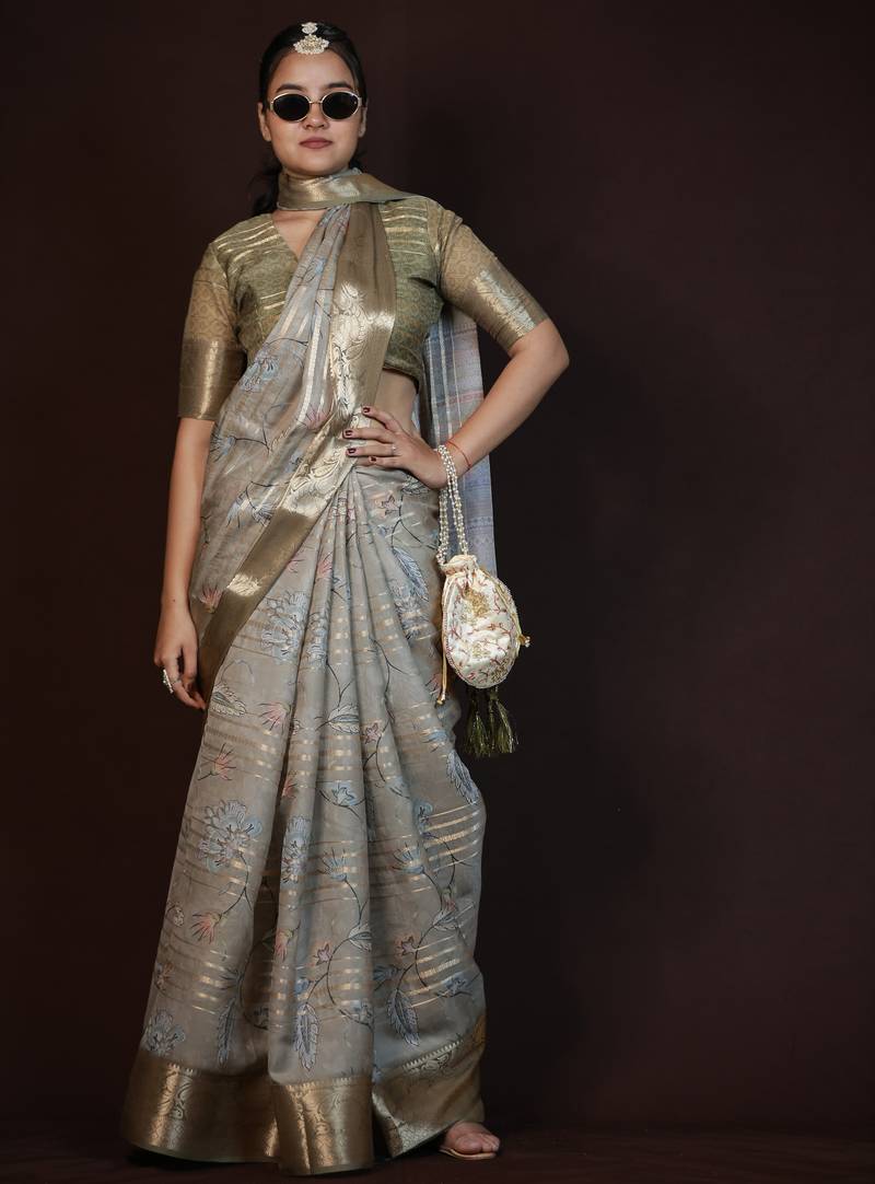 green floral print zari woven border crepe saree with unstiched blouse piece