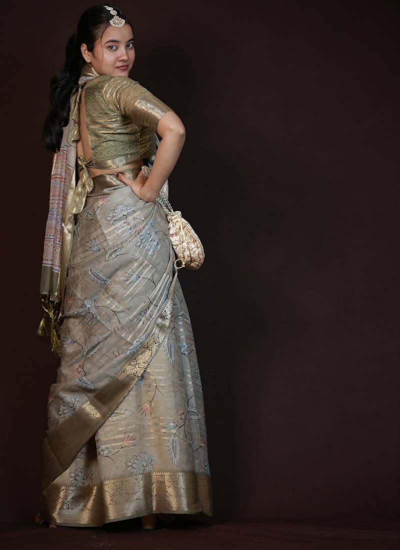 green floral print zari woven border crepe saree with unstiched blouse piece