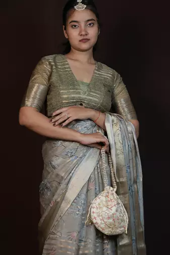 green floral print zari woven border crepe saree with unstiched blouse piece