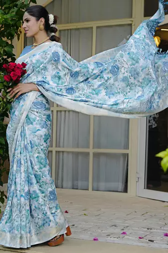 pastel blue floral print zari woven border silk blend saree with unstiched blouse piece