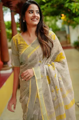 beige floral print zari woven border cotton blend saree with unstiched blouse piece