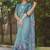teal abstract print zari border cotton blend saree with unstiched blouse piece