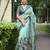 teal abstract print zari border cotton blend saree with unstiched blouse piece