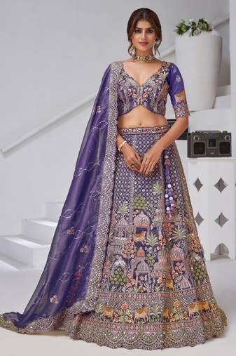 Divine Elegance in Purple – Bridal Lehenga with Temple & Cow Motifs