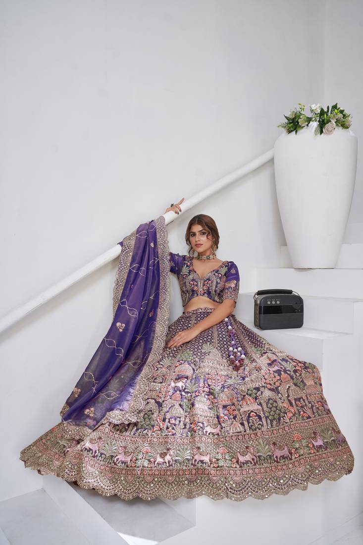 Divine Elegance in Purple – Bridal Lehenga with Temple & Cow Motifs