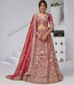 Traditional  dark Pink Bridal Lehenga Featuring Auspicious Cow and Temple Motifs