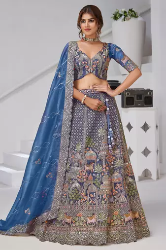 Teal Blue Raw Silk Bridal Lehenga Featuring Temple, Cow & Floral Embroidery