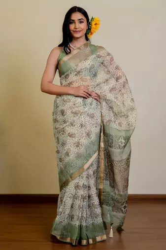 cream paisley floral print zari woven border polyester saree with unstiched blouse piece