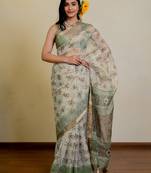 cream paisley floral print zari woven border polyester saree with unstiched blouse piece