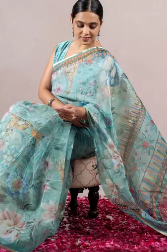 turquoise floral print zari woven border organza saree with unstiched blouse piece