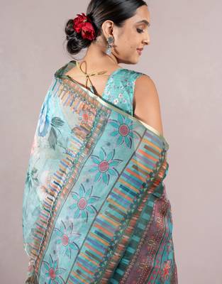 turquoise floral print zari woven border organza saree with unstiched blouse piece 4