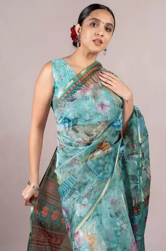 turquoise floral print zari woven border organza saree with unstiched blouse piece