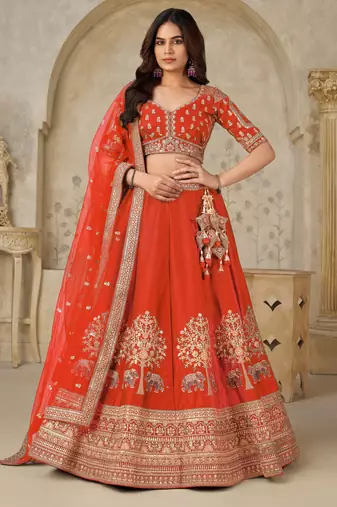 Trendy Rust Wedding Lehenga with Elephant Motifs