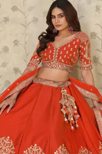 Trendy Rust Wedding Lehenga with Elephant Motifs