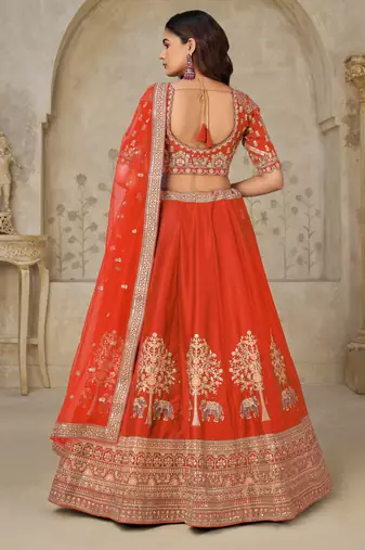 Trendy Rust Wedding Lehenga with Elephant Motifs