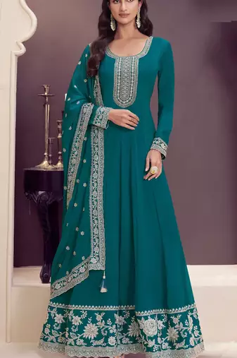 Dark green embroderied silk anarkali suit
