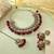 Maroon color kundan necklace set