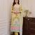 Floral printed yellow round neck silk kurta with trouser & dupatta set