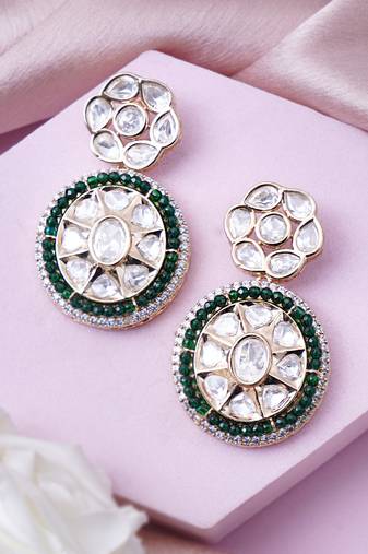 Women gold finish earrings with green embellishments