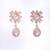 Women drop earrings in rose gold finish with diamond stones