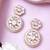 Women gold finish earrings featuring sparkling diamond embellishments