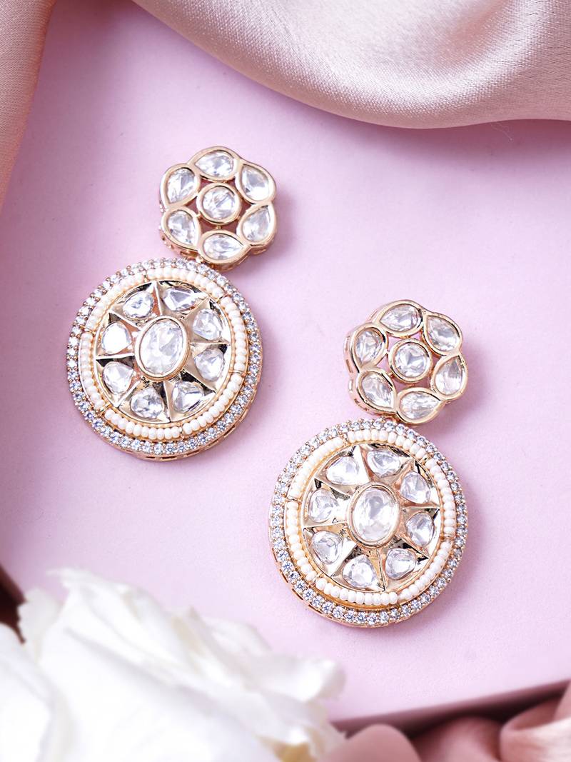 Women gold finish earrings featuring sparkling diamond embellishments